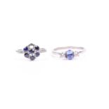 A 9ct white gold, tanzanite and diamond ring, set with a mixed oval-cut tanzanite, flanked with
