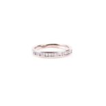 A diamond half hoop eternity ring, the alternating round brilliant and baguette cut diamonds channel