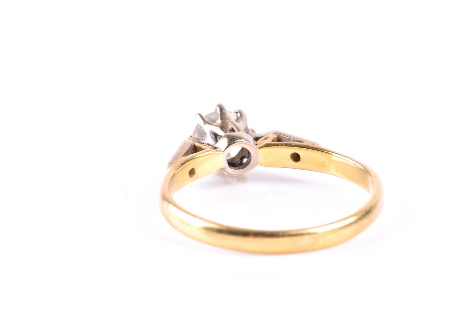 A single stone diamond ring, the round brilliant cut diamond in eight claw mount to three stone - Image 3 of 5