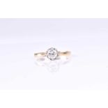 A single stone diamond ring, the round brilliant cut diamond in eight claw raised scalloped mount,