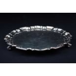 A mid-20th century silver salver, Sheffield 1958 by Walker & Hall, of scalloped edge form on three