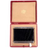 Cartier. A silver cigarette case with black crocodile skin cover, of rectangular form, marked '