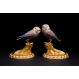 A large pair of silver and silver gilt owls, 20th century, with gilt beak and brows, one with