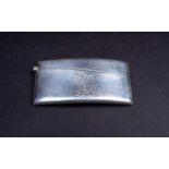 A silver card case, of curved rectangular form, 8.5 cm long, engraved 'Ostend 1913', hallmarked