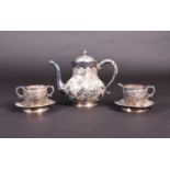 A Chinese silver part tea set, comprising teapot, milk jug, sugar bowl and two saucers, each with