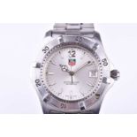 A Tag Heuer Professional stainless steel wristwatch the silvered dial with luminous baton indices,