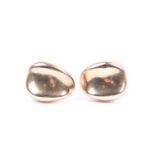 Peter Wong; a pair of contemporary hollow gold earrings, slightly concave tear drop shaped, with