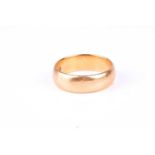 A 22ct yellow gold wedding band, of plain design, approximate width of band 5mm, size N 1/2.