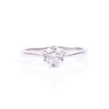 An 18ct white gold and solitaire diamond ring, set with a round brilliant-cut diamond of