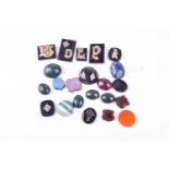 A small group of various loose hardstones, including cabochon bloodstone, agate, garnet, lapis,