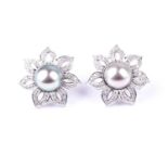 A pair of diamond and Tahitian pearl floral earrings, each set with a large grey pearl of