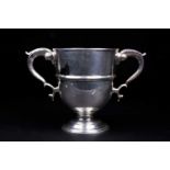 A George V silver twin-handled trophy, London 1920 by Charles & Richard Comyns, 20 cm high, 40 ozt.