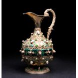 An Austrian silver gilt and enamel ewer, 20th century, set with green jade and pearl cabochons