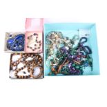 A group of jewellery items, including a tigers eye necklace, bracelet and earrings, a malachite