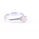 A single stone diamond ring, the round brilliant cut diamond in simple six claw mount, to plain 18ct