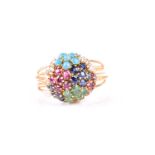 A tutti fruite bombe style cocktail ring; formed as a collection of flower head clusters in