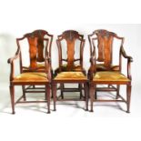 A set of six mahogany dining chairs, circa 1900, the shaped top rail with carved foliate decoration,