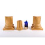 A David Linley part desk set, comprising a pair of wooden book ends modelled as the bases of