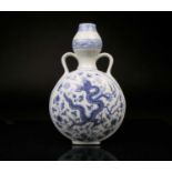 A Chinese blue and white pilgrim vase, the garlic shape neck with ruyi head handles, the body