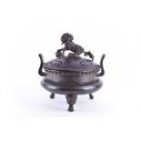 A Chinese bronze censer and cover, Ming dynasty, the cover with bronze patinated white metal Dog