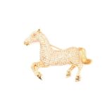 A yellow gold and diamond brooch in the form of a prancing pony, pave-set with diamonds of