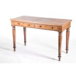 A Victorian mahogany writing table, with later stained pine top, with two drawers, supported on