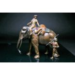 A cold painted bronze 'The Tiger Hunt' by Franz Bergman, a figure astride the elephant, a dead tiger