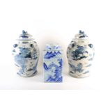 A pair of Chinese Shi shi vases and covers, the cover with Shishi and ball knop with clouds, the