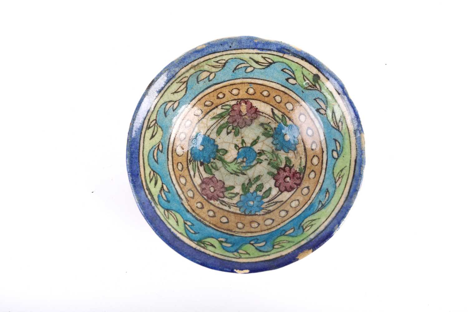 A Persian Isnik pottery bowl, Safavid/Qajar 18th century, the interior painted with flowers - Image 2 of 3