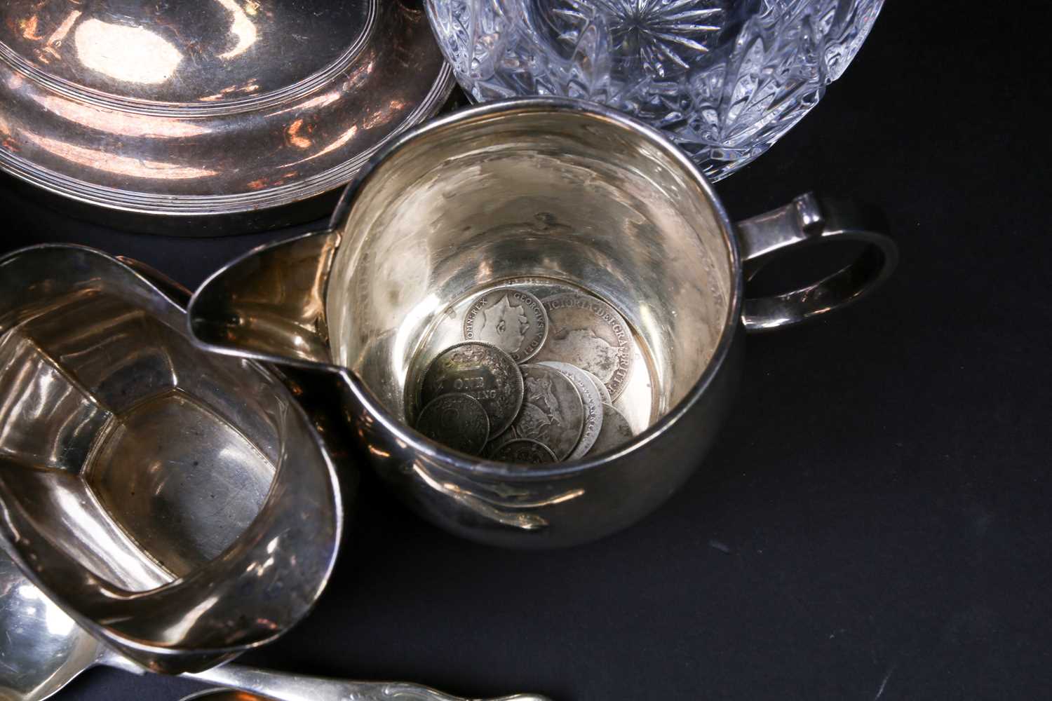 A mixed group of silver and white metal items, to inlcude flatware, cream jugs, a sauce boat, - Image 9 of 9