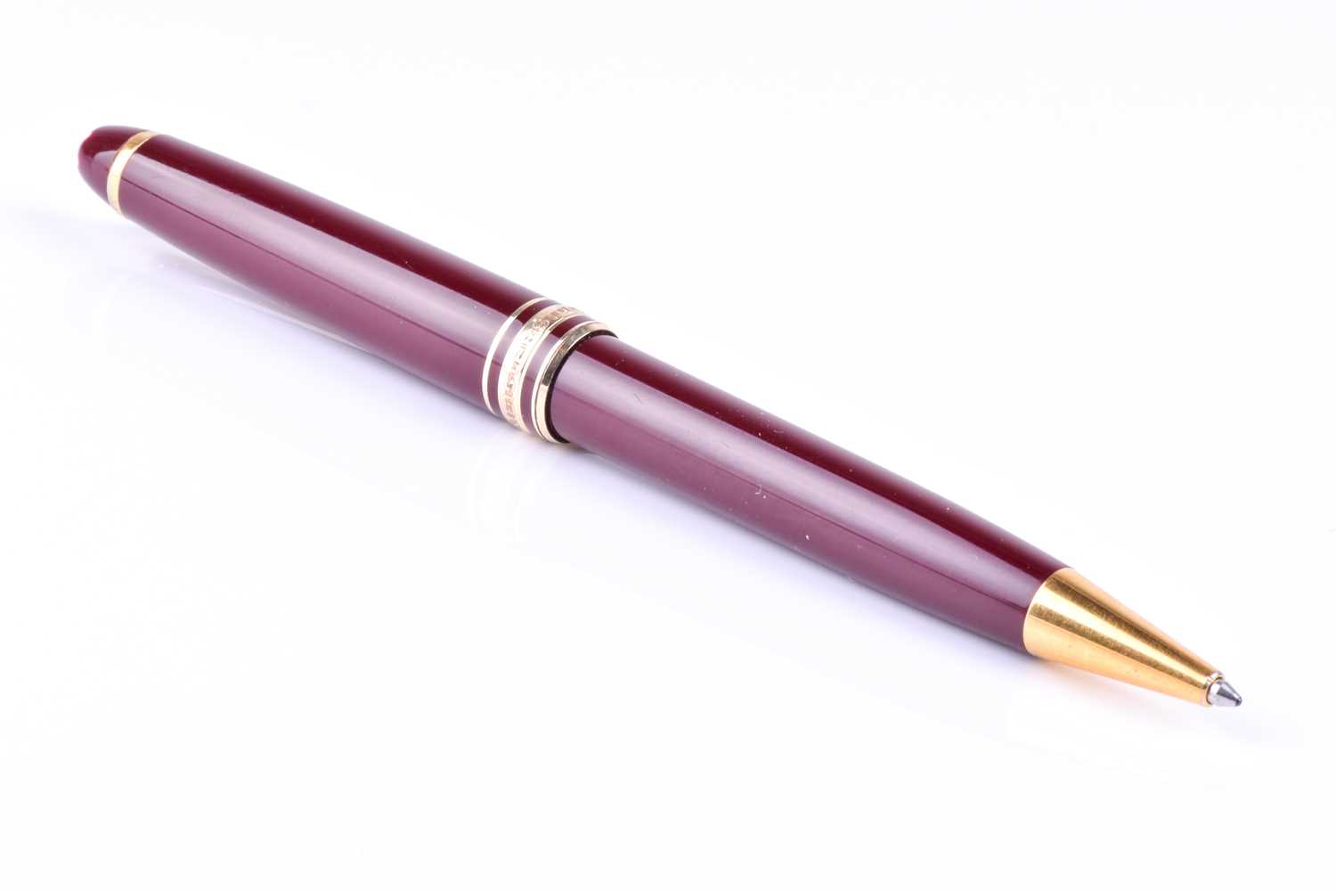 A Montblanc Meisterstuck ballpoint pen, with maroon coloured resin body and cap, and gilt metal - Image 7 of 7