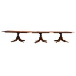 A large Geo III style mahogany triple pedestal dining table, 19th century Irish, with three large