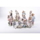 A group of twelve assorted Lladro porcelain figures, the tallest 23 cm.Qty: 12Condition report: No