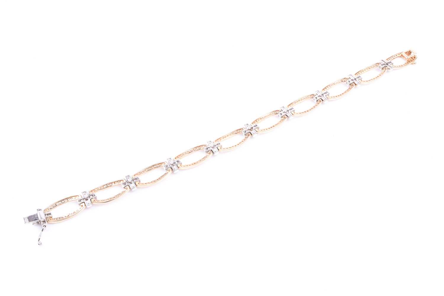 A 14ct yellow and white gold and diamond bracelet, comprised of openwork oval and square segments,