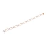 A 14ct yellow and white gold and diamond bracelet, comprised of openwork oval and square segments,