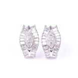 A pair of diamond cluster earrings, of tapered design, centred with a cluster of small round-cut