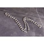 A French platinum and pearl necklace, the pearls set between trace links, 42cm long.Condition