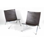 A pair of Paul Kjaerholm 'PK22' chairs from a 1956 design, in chrome and brown leather, the