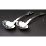 A pair of Victorian silver sauce ladles, London 1858 by George Adams, fiddle, thread and shell