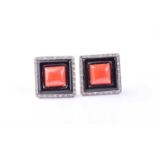 A pair of Art Deco style diamond, onyx and coral earrrings, the squares plaques set with a central