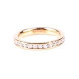 A full hoop diamond eternity ring, the round brilliant cut diamonds channel set in an 18ct gold