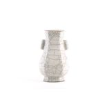 A Chinese Ge celadon style arrow vase, in the Ming style, the rim with an unglazed band, on an