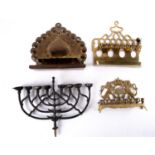 A Polish brass menorah, decorated with the lions' of Judah supporting a Torah crown, 20.5cm wide,