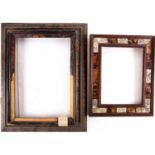 An antique Northern European frame with tortoiseshell veneer, together with a smaller example with