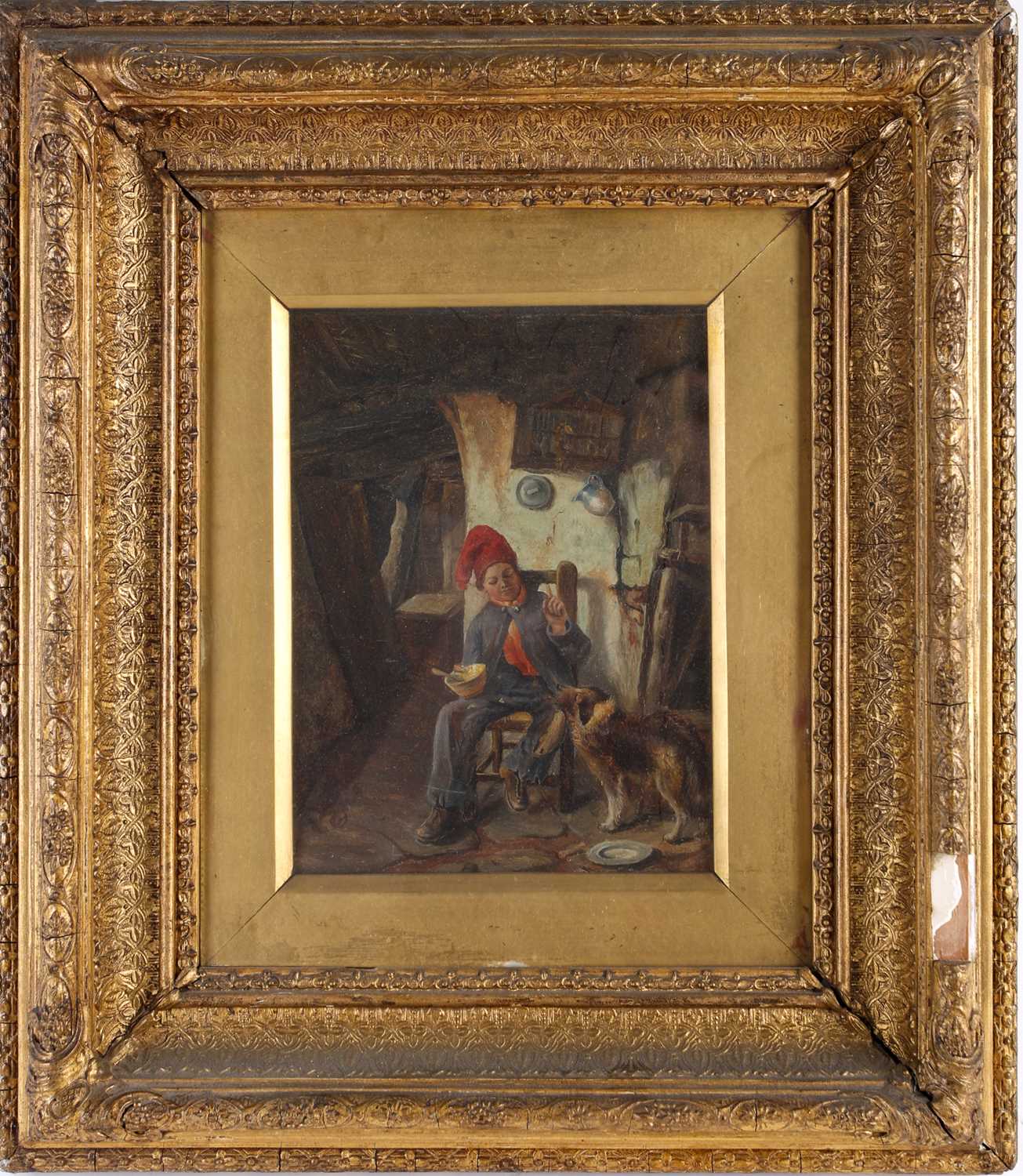 19th century Continental school, a boy and his dog in an interior scene, oil on panel, unsigned,