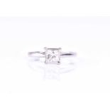 A square brilliant-cut diamond ring, set with a single stone of approximately 0.80 carats,