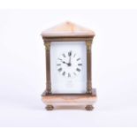 A brass carriage clock, circa 1900, the enamel dial inscribed' Exd by Dent, 61 Strand, London', with