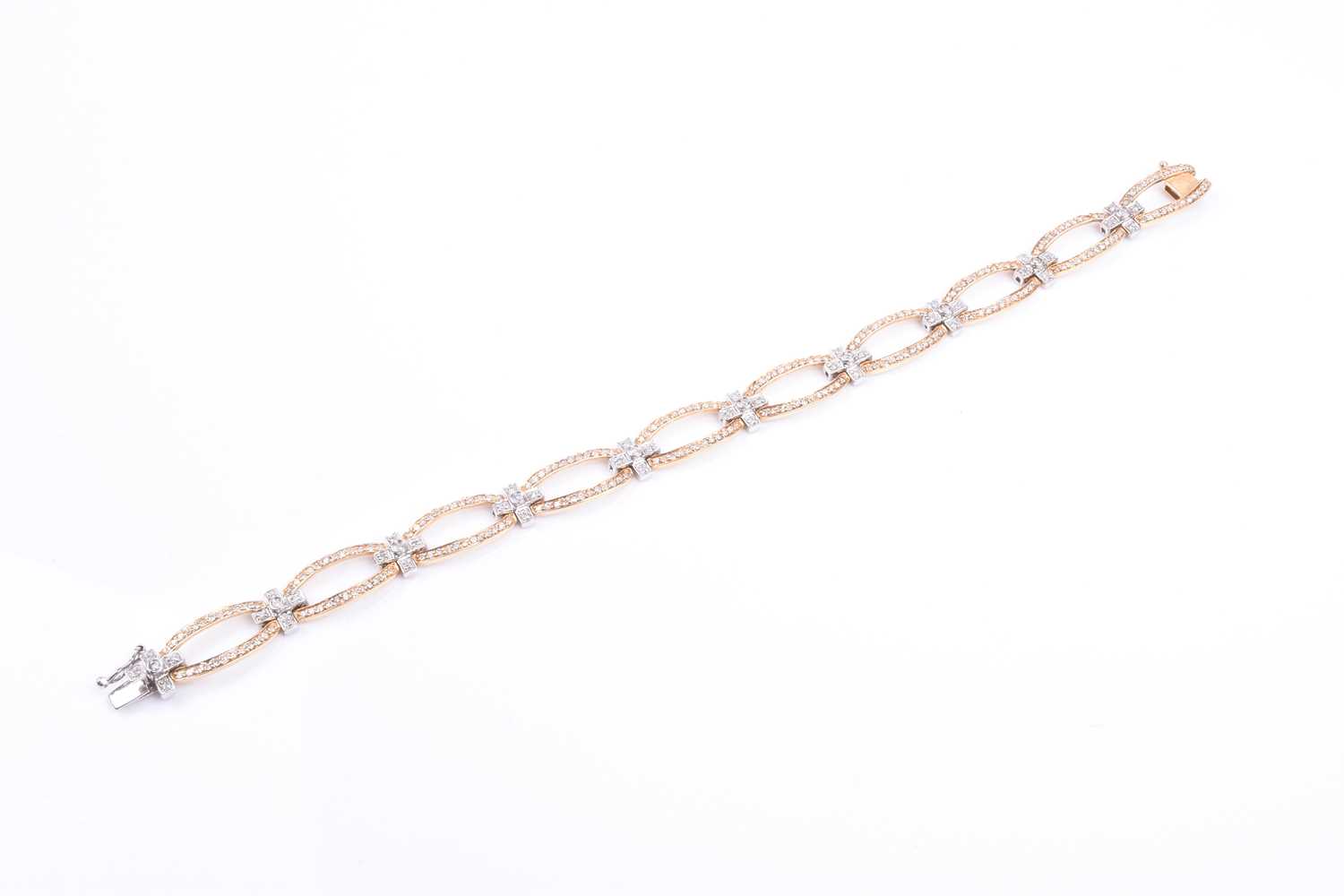 A 14ct yellow and white gold and diamond bracelet, comprised of openwork oval and square segments, - Image 2 of 5