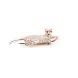 A diamond and sapphire cat brooch, in the form of a reclining panther, the body pave-set with