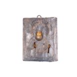 A small rectangular Russian icon with silver mount and velvet back, cyrillic text to the bottom,